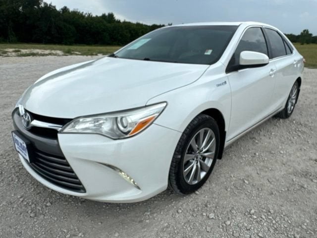 2017 Toyota Camry Hybrid LE in Blizzard Pearl — front three-quarter view