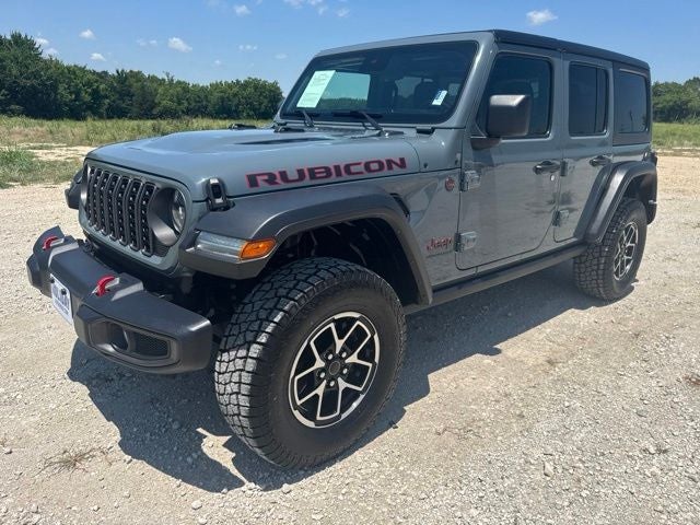 2024 Jeep Wrangler Rubicon in Anvil Clear Coat — front three-quarter view