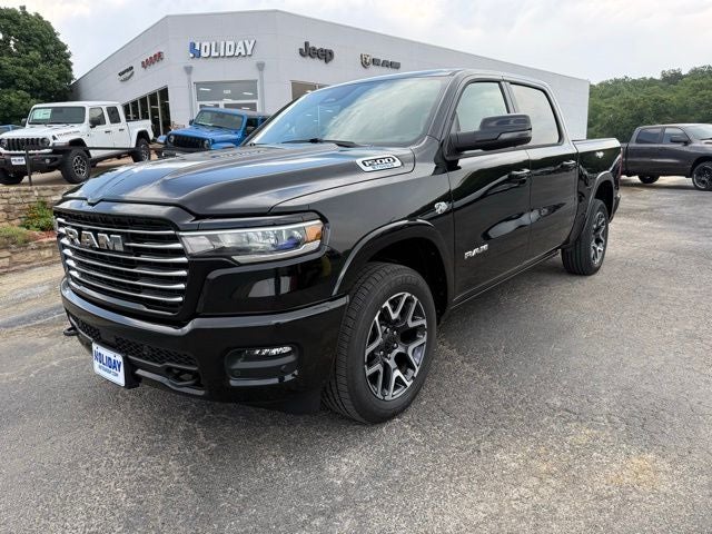 2026 RAM Ram 1500 RAM 1500 LARAMIE CREW CAB 4X4 5'7' BOX in Diamond Black Crystal Pearl-Coat Exterior Paint — front three-quarter view