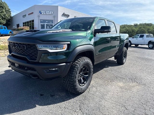 2026 RAM Ram 1500 RAM 1500 RHO CREW CAB 4X4 5'7' BOX in Serrano-Green Metallic Exterior Paint — front three-quarter view