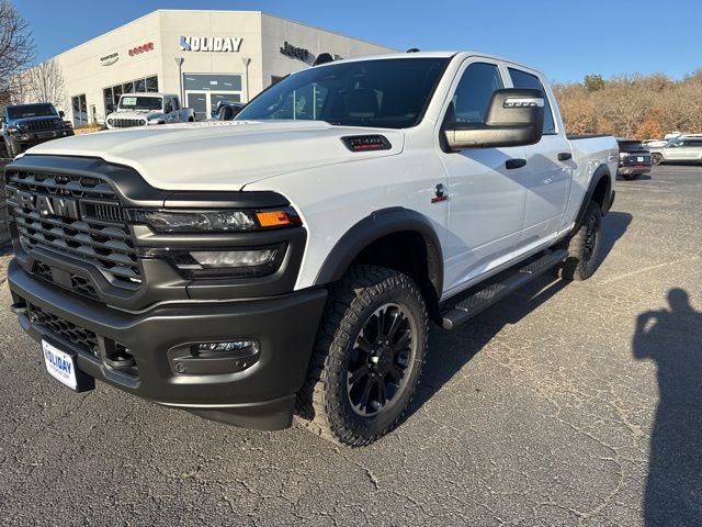 2026 RAM Ram 2500 RAM 2500 WARLOCK CREW CAB 4X4 6'4' BOX in Bright White Clear-Coat Exterior Paint — front three-quarter view